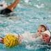 Skyline Abby McDonough is defended while reaching for a loose ball in the game against East Lansing on Friday, May 10. Daniel Brenner I AnnArbor.com